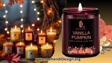 A collection of various best fall scented candles with warm, cozy lighting and autumnal decoration in the background