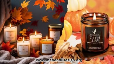 Best fall candles arranged in a cozy display with autumn leaves, a warm blanket, and softly glowing, fall-scented candlelight.