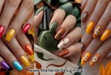 Most popular fall nail colors featured on a manicured hand with deep green, burnt orange, and creamy neutrals, styled with subtle abstract swirl designs