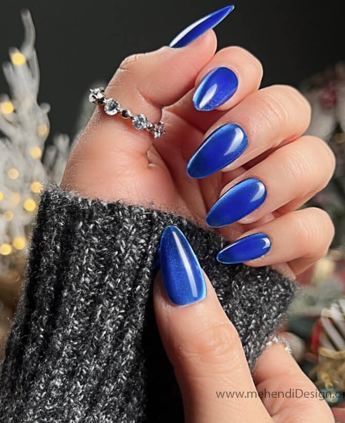 Image of A bold and sparkling full blue glitter manicure for Labor Day A bold and sparkling full blue glitter manicure for Labor Day