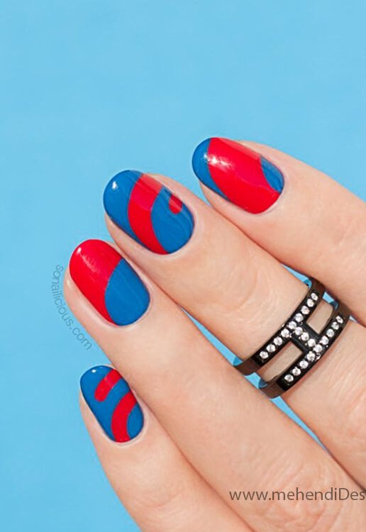 Image of A bold half and half nail design with red and blue A bold half and half nail design with red and blue