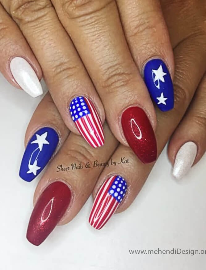 Image of A chic red manicure with a star spangled navy blue accent nail for Labor Day A chic red manicure with a star-spangled navy blue accent nail for Labor Day
