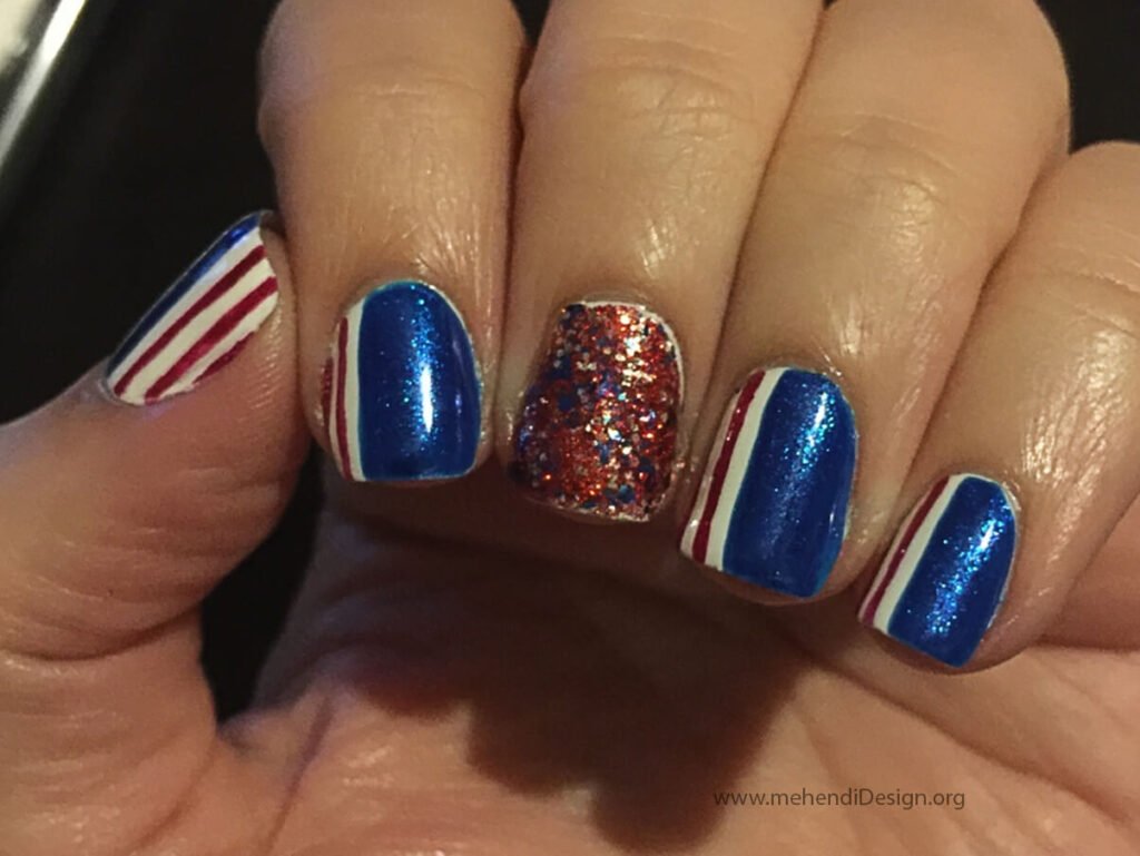 Image of A glamorous patriotic glitter fade nail design for Labor Day A glamorous patriotic glitter fade nail design for Labor Day