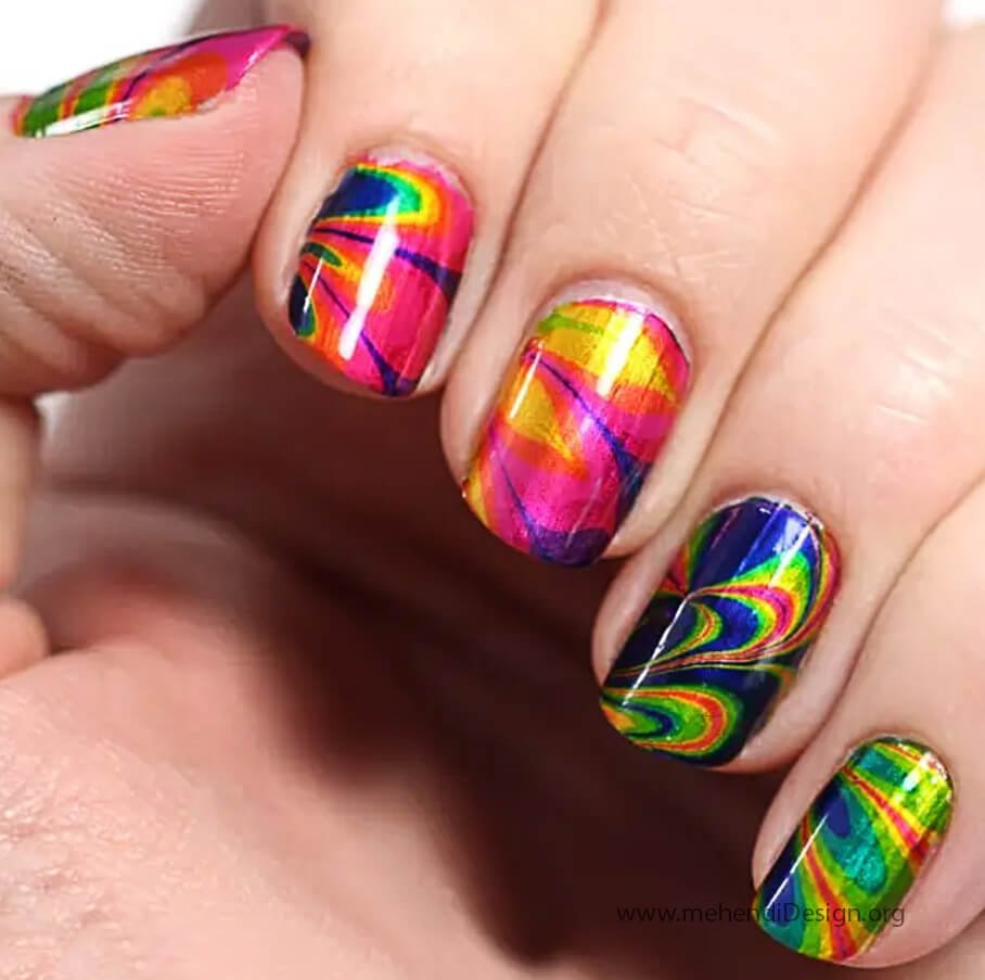 Image of A stunning red white and blue water marble nail art design A stunning red, white, and blue water marble nail art design