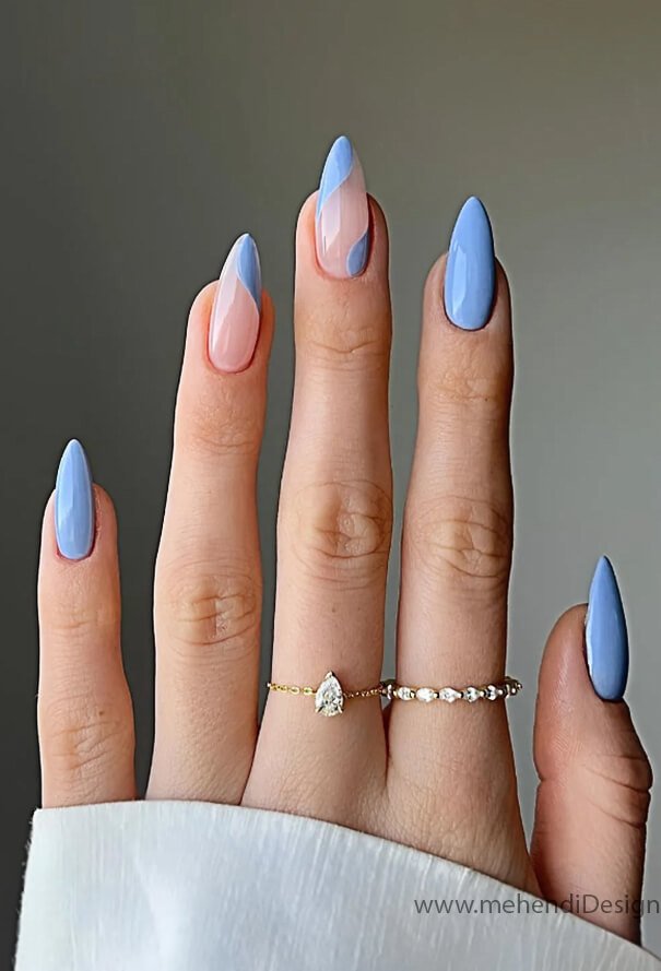 Image of A super subtle and elegant manicure with a sheer pastel blue wash A super subtle and elegant manicure with a sheer pastel blue wash