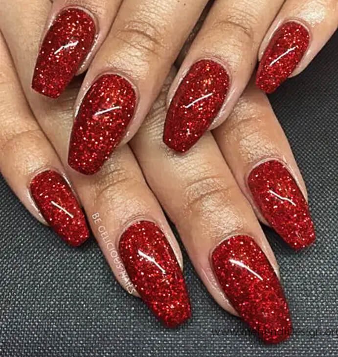 Image of Dazzling red glitter nails with a white star accent for a glam Labor Day Dazzling red glitter nails with a white star accent for a glam Labor Day