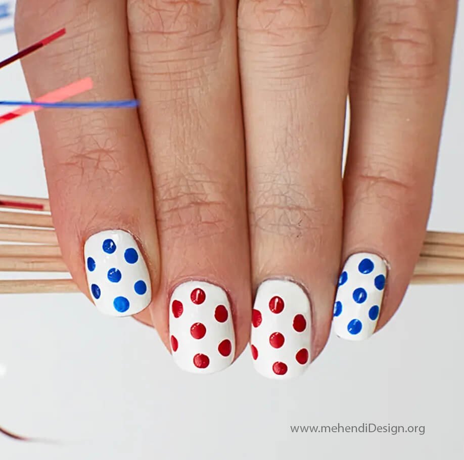 Image of Festive Labor Day nails with a red white and blue confetti topcoat Festive Labor Day nails with a red, white, and blue confetti topcoat