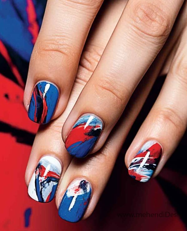 Image of Modern art inspired Labor Day nails with abstract red and blue brushstrokes Modern art-inspired Labor Day nails with abstract red and blue brushstrokes