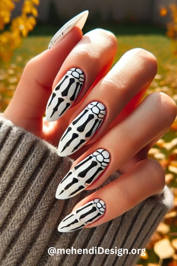 Image of Detailed skeleton hand nail art on black acrylic nails a spooky and artistic halloween nail design acrylic Detailed skeleton hand nail art on black acrylic nails, a spooky and artistic halloween nail design acrylic