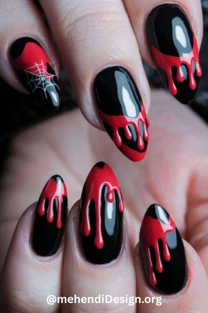 Image of Sharp vampire fang acrylic nails a bold and scary halloween design Sharp vampire fang acrylic nails, a bold and scary halloween design
